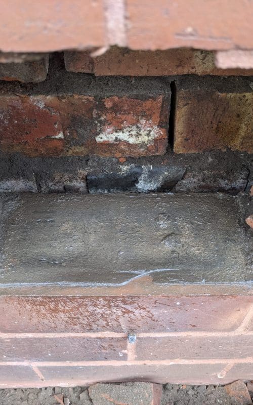 80 year old damp proof course exposed during a rising damp dispute survey.